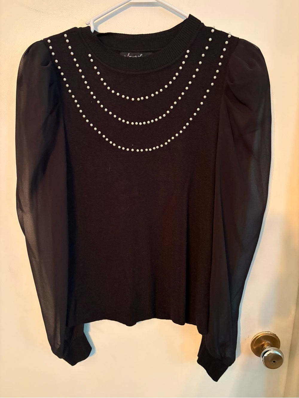 A Love Story size large Black Puff-Sleeve Top with Pearl Accent